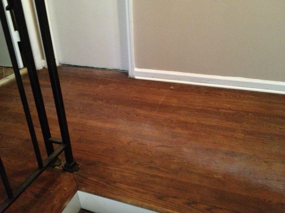 a wood floor that needs to be refinished